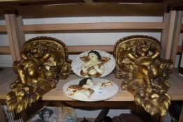 A pair of modern composition gilt effect wall brackets with cherub mounts together with a pair of