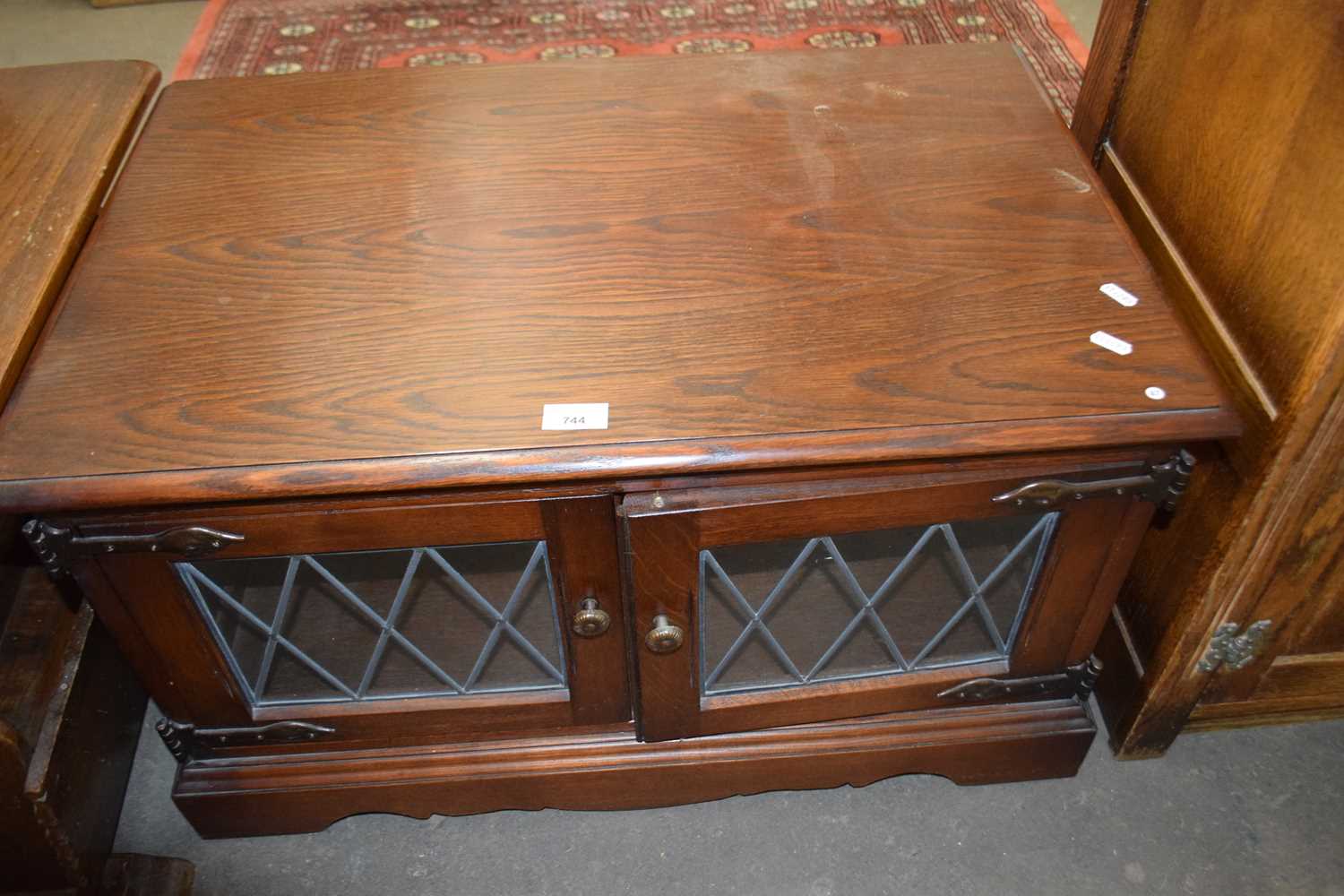 Coffee table cupboard with glazed doors