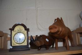 Mixed Lot: A wooden model rhino, a wooden warthog and a modern mantel clock (3)