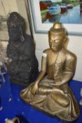 Gold painted model of a seated Buddha together with another similar