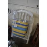 White folding garden chair with striped padded seating