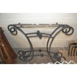 Two wrought iron table supports