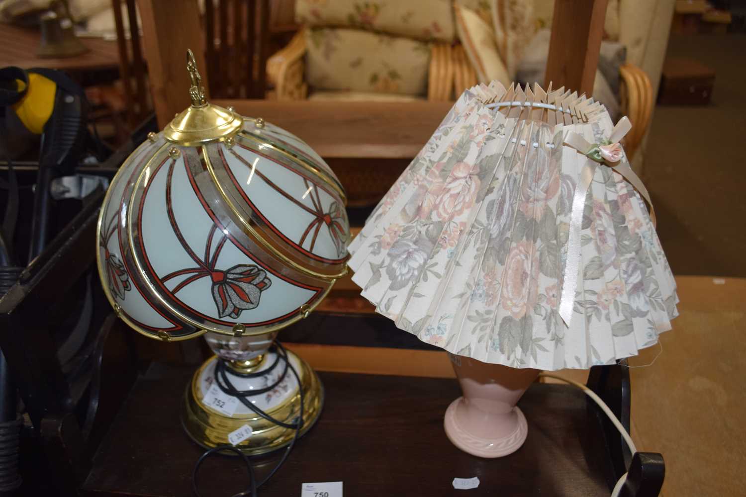 Brass effect ceramic and glass table lamp together with a pale pink ceramic table lamp and floral