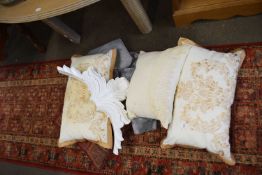 Pair of cream and gold embroidered cushions together with two other cushions and a silver tasseled