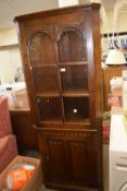 A glazed corner cupboard