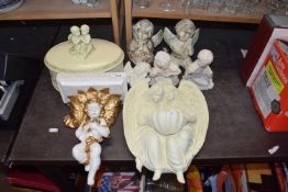 Quantity of plaster moulded cherubs to include figurines, wall brackets, trinket box etc