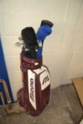 Mizuno burgundy and cream golf caddy and a quantity of assorted clubs
