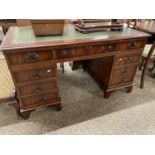 Reproduction mahogany twin pedestal office desk with green leather inset top, 137cm wide x 77cm high