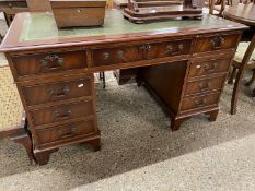 Reproduction mahogany twin pedestal office desk with green leather inset top, 137cm wide x 77cm high