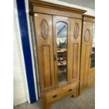 Late Victorian American walnut wardrobe with mirrored door and drawer to base