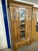 Late Victorian American walnut wardrobe with mirrored door and drawer to base