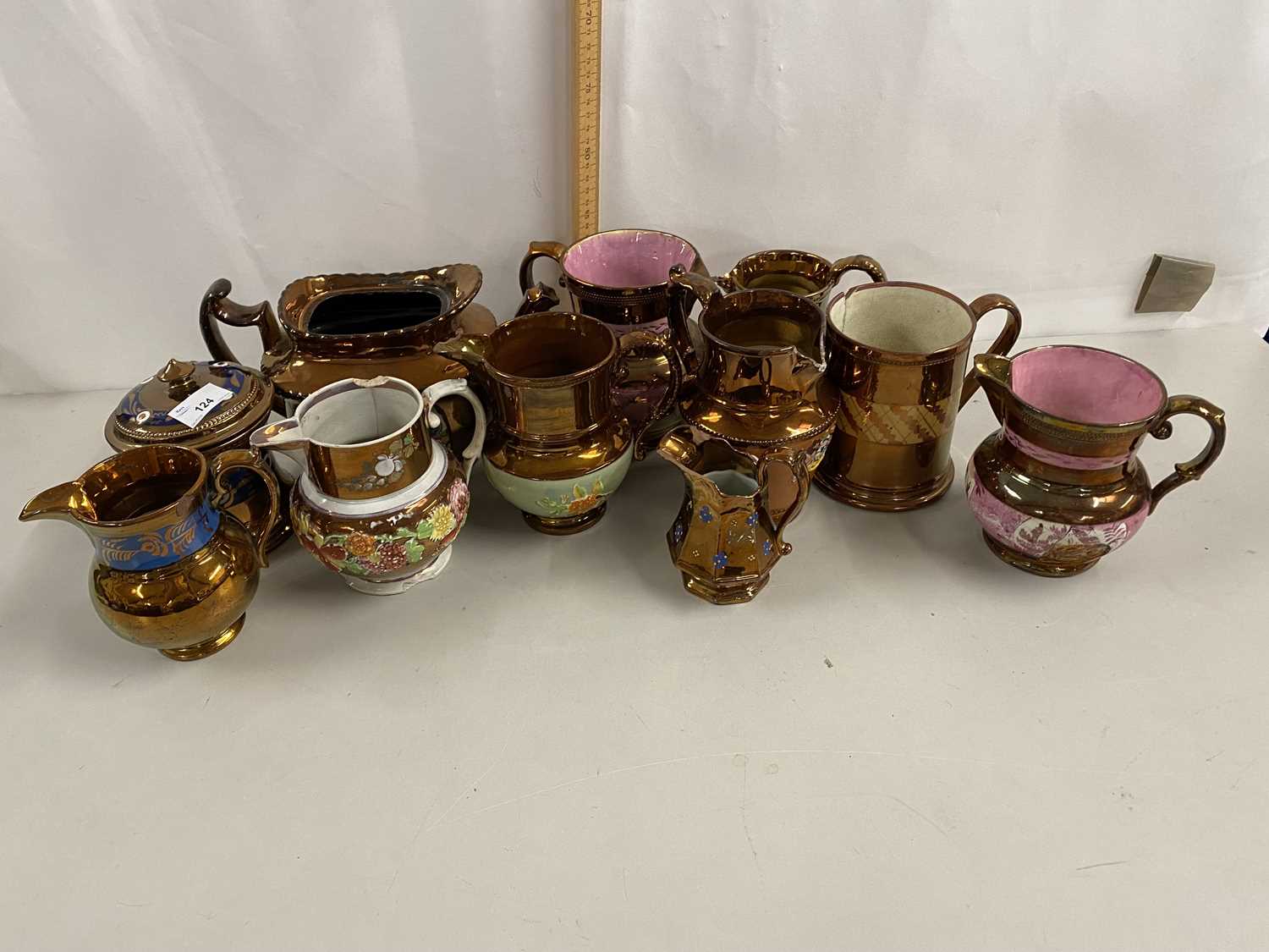 Collection of various Victorian copper lustre finish jugs and related items