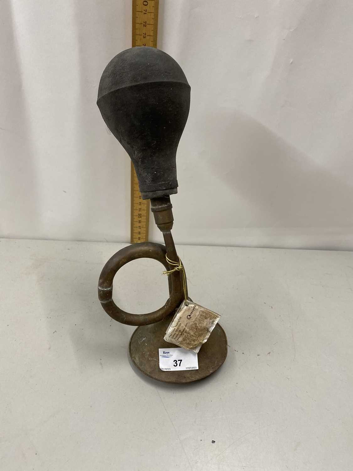 A reproduction brass taxi horn