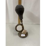 A reproduction brass taxi horn