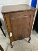 Late 19th or early 20th Century mahogany single door music cabinet on cabriole legs