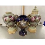 A pair of large 20th Century rose decorated vases and a further blue double handled vase