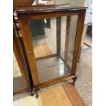 A serpentine front glazed single door display cabinet, 60cm wide