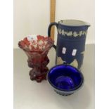 An Adams Jasper ware jug together with a bohemian cut glass goblet and a further blue glass bowl