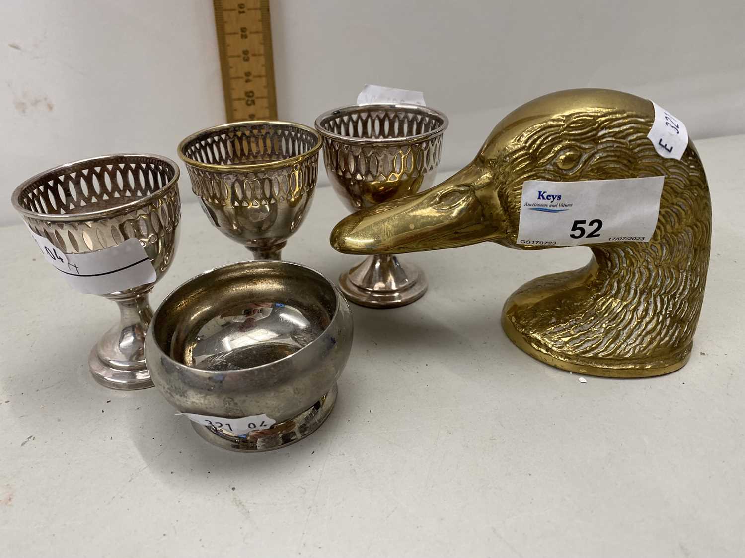 Mixed Lot: Silver plated egg cups, brass ducks head bottle opener etc