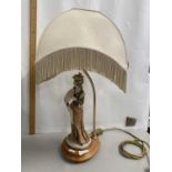 Modern table lamp with figural base