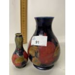 A Moorcroft pomegranate pattern baluster vase together with a further miniature Moorcroft