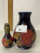 A Moorcroft pomegranate pattern baluster vase together with a further miniature Moorcroft