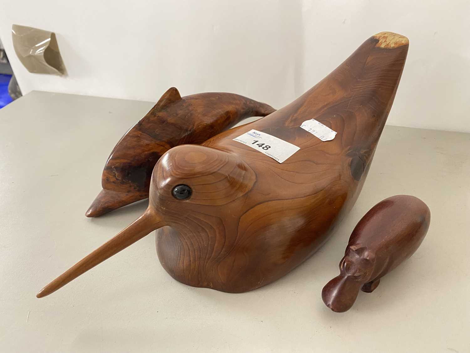 Mixed Lot: Polished wooden moden of a woodcock together with a further hippo and a dolphin (3)