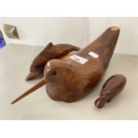 Mixed Lot: Polished wooden moden of a woodcock together with a further hippo and a dolphin (3)