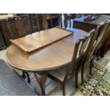 Edwardian oval extending dining table with two leaves together with a set of six Queen Anne style