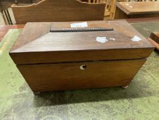 A 19th Century rosewood sarcophagus formed tea caddy with sub-divided interior raised on bun feet,