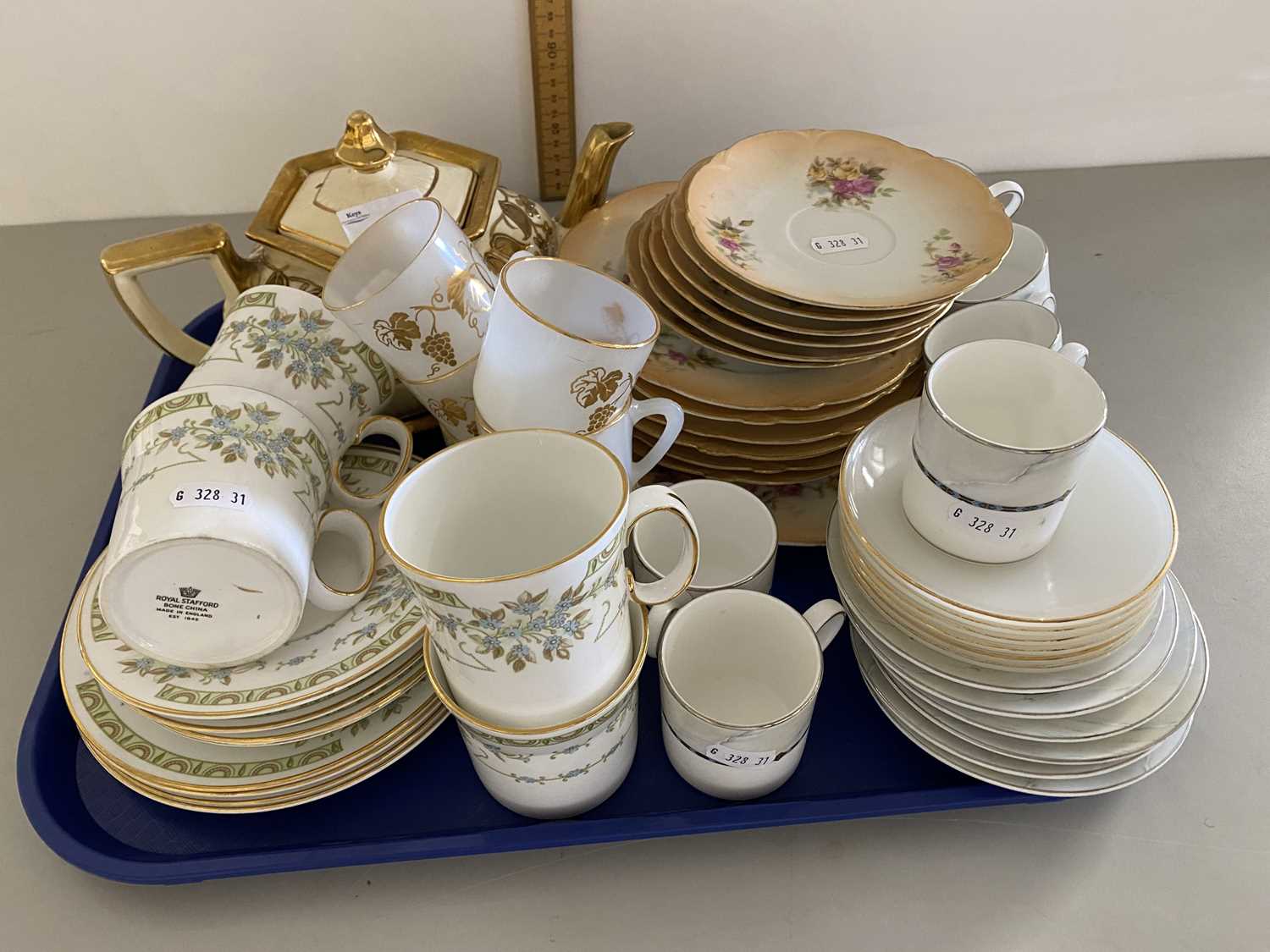 Tray of various mixed tea wares to include Royal Stafford, Wedgwood coffee wares etc