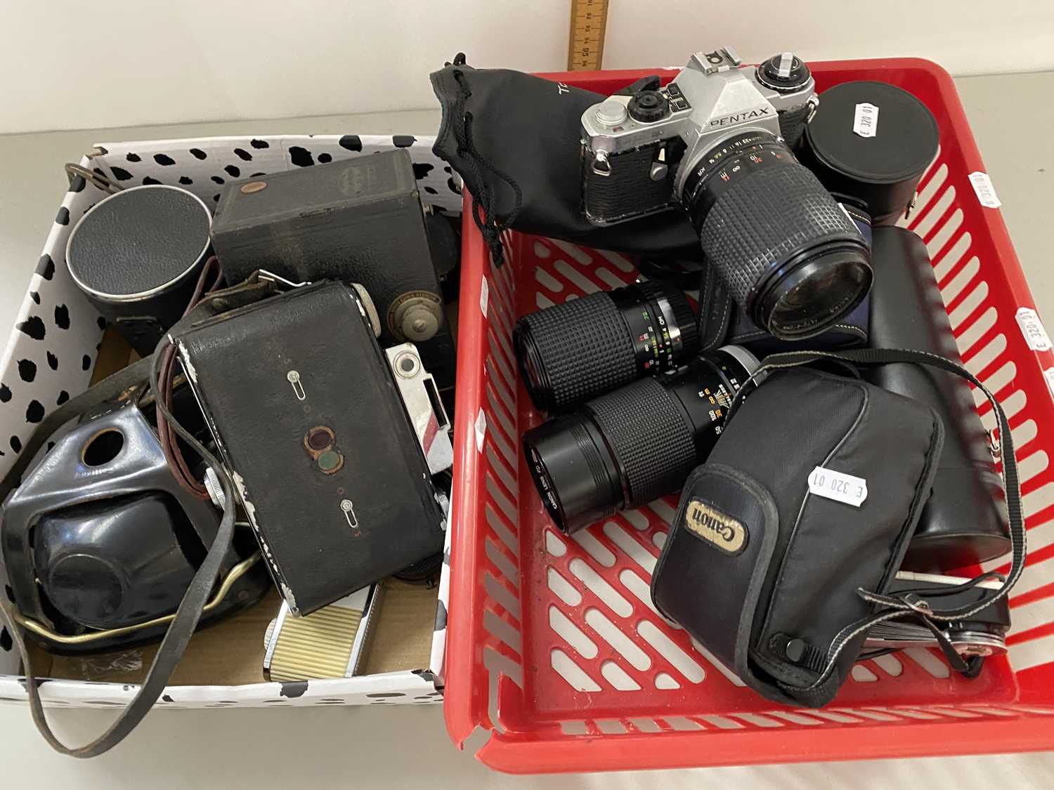 Box of various vintage cameras