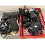 Box of various vintage cameras