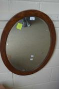 Oval framed wall mirror