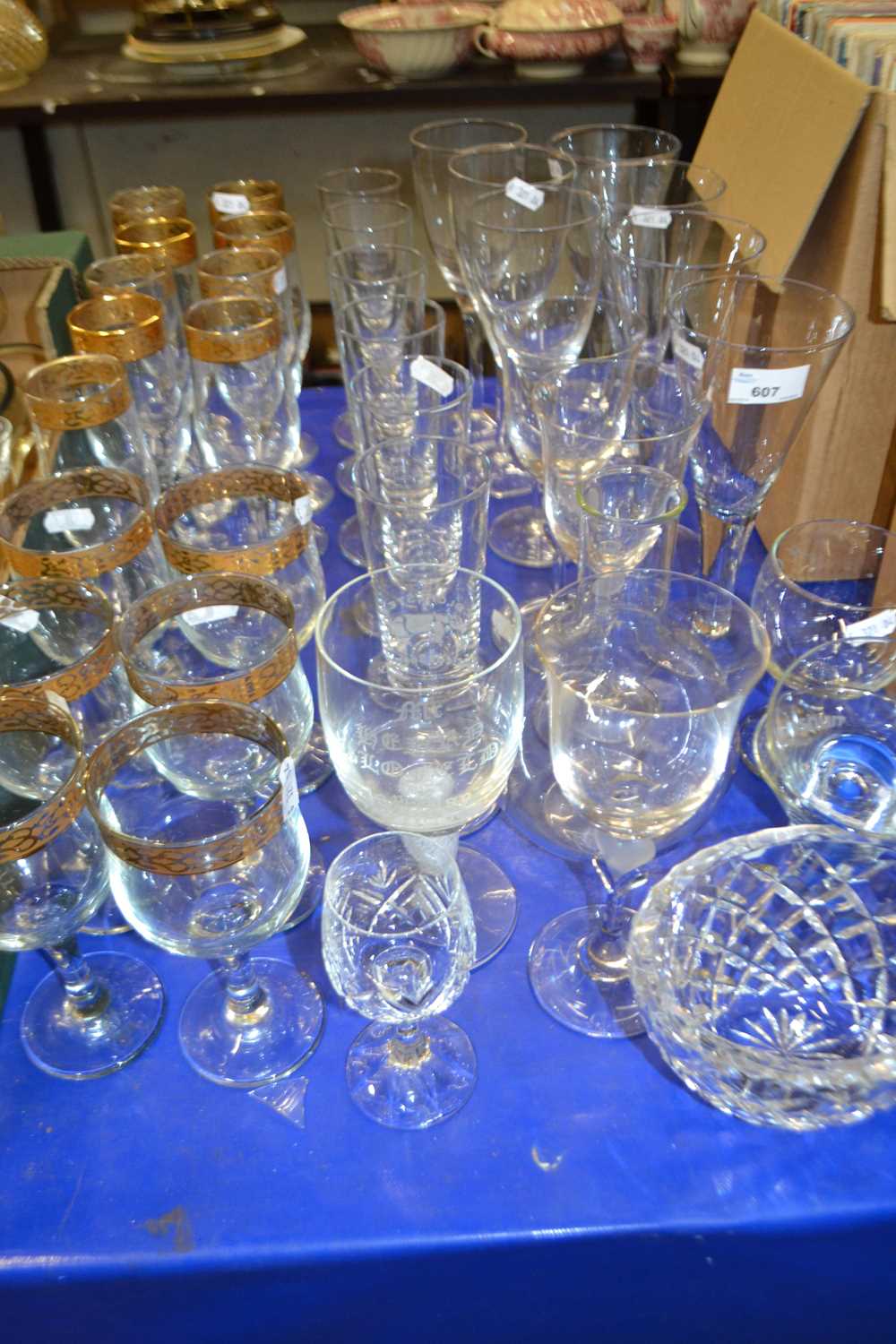 A quantity of assorted drinking glasses to include gilt rimmed champagne flutes and similar wine