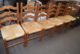 Set of six pine and rush seated kitchen chairs