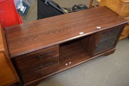 TV cabinet with three drawers to one side, glazed cupboard to other and hollow central cubby, approx