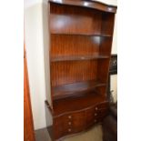 Late 20th Century serpentine fronted bookcase cabinet with six small drawers below