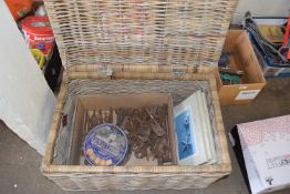 Wicker hamper together with a quantity of assorted spanners, drill bits and other tools