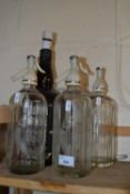 Three vintage Schweppes soda syphon and a novelty whisky bottle table lamp (4)