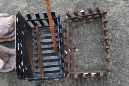 Two cast iron fire grates