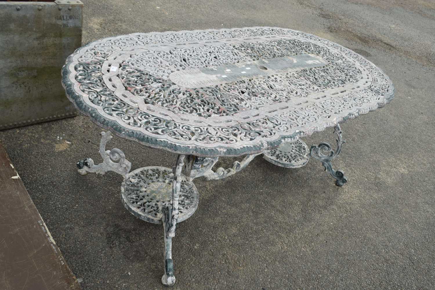 Cast aluminium oval topped garden table with pierced decoration