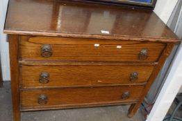 An oak three drawer chest of drawers