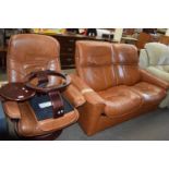 Tan two piece recliner sofa and similar armchair with matching footstool
