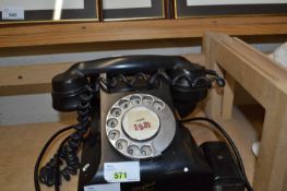 A mid 20th Century bakelite style telephone