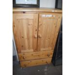 Pine cupboard with two drawers below, 73cm wide