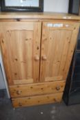 Pine cupboard with two drawers below, 73cm wide