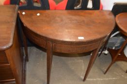 Mahogany demi lune card table with green baize interior