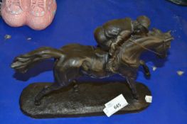 A resin figure of a racehorse and rider "The Outsider"