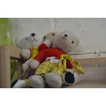 A collection of Rupert the Bear plush toys. AF